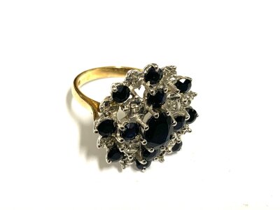 A vintage 9ct gold sapphire and diamond chip cluster dress ring, Size M