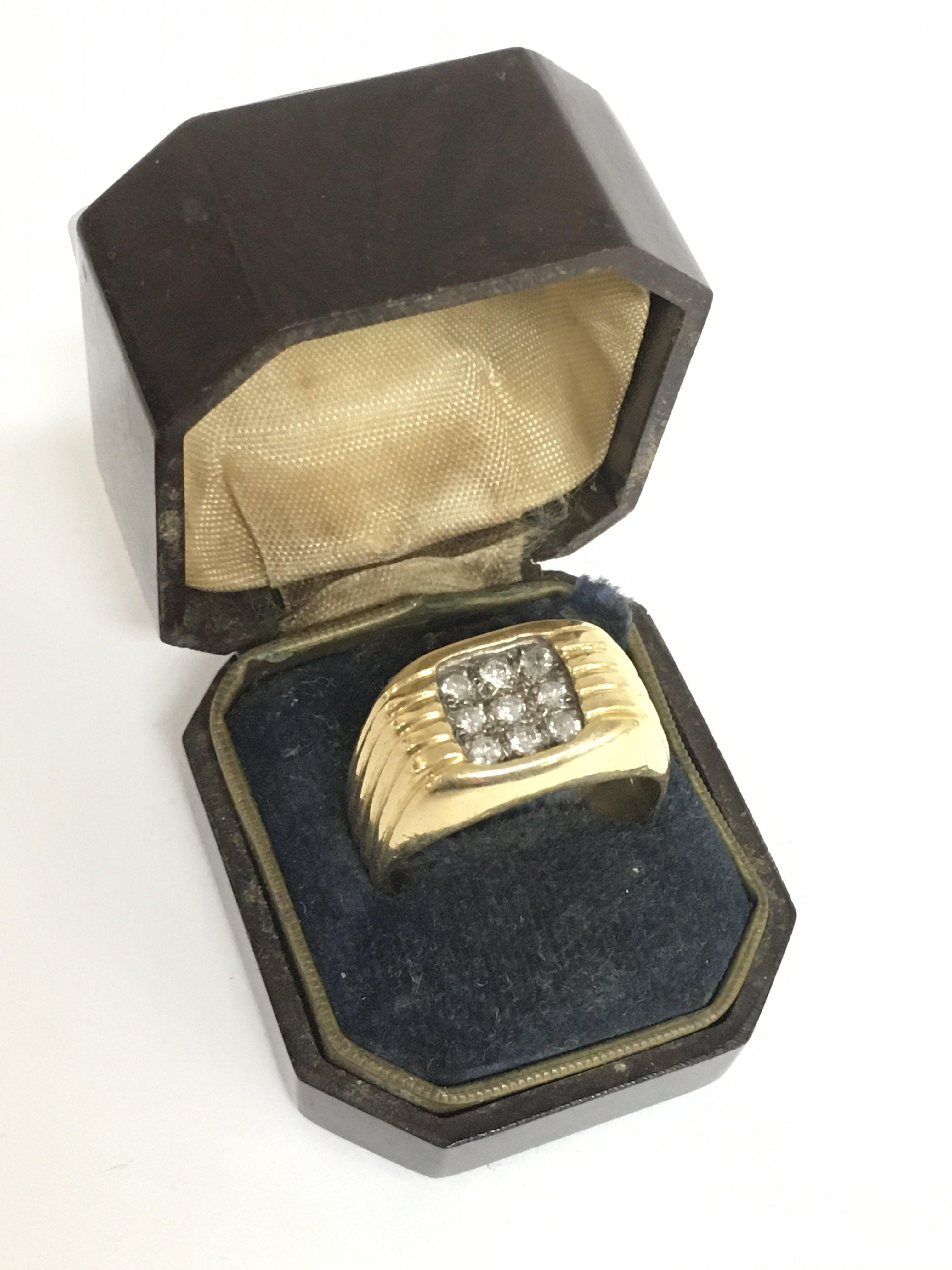 An 18ct gold signet ring set with diamonds , weight 15.2g size T/U