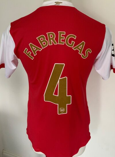 2006 - 2008 Arsenal Fabregas Match Worn Football Shirt: Red short sleeve with Fabregas 4 to rear in gold. Champions League badging to arm.