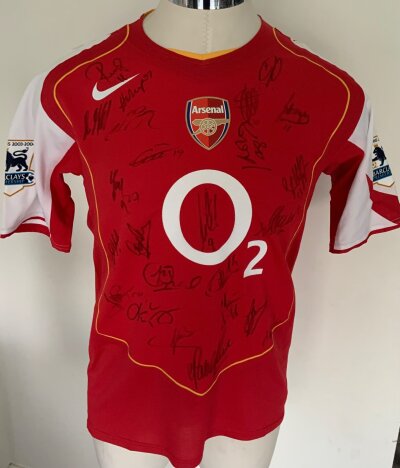 2004 - 2005 Arsenal Fully Signed Match Worn Football Shirt: Red short sleeve with Lauren 12 to rear and Premier League sleeve badging with gold trim stating Champions 2003 - 2004. Signed to front with 24 genuine autographs.