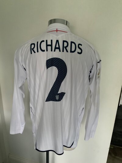 2007 England Richards Match Worn Football Shirt: White long sleeve shirt with Richards 2 to rear. Number 2 also to front breast along with words England v Estonia 13 10 2007.
Richards has signed boldly to front.