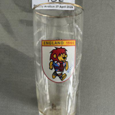 1966 World Cup German Beer Glass: Dortmunder Union Bier glass has World Cup Willie to one side, beer brand to the other and the participating teams etched to glass. Probable half pint glass. 