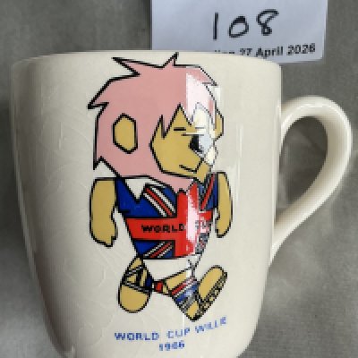 1966 World Cup Willie Football Mug: Good condition white mug with a colourful WC Willie to one side. Football Association copyright to base. Never been broken but you can see a crack. 