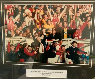 Arsenal 1998 Title Winning Bench Celebration: This was part of the Highbury Stadium Sale. Comes with COA and measures approximately 55 x 44cm. Slightly scratched to the frame.