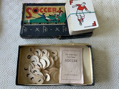 Waddingtons Soccer Football Card Game: Believed to be from 1938 and complete of cards and counters with instructions. Damaged box. C/W small booklet from the mid 30s with collected replica autographs of famous footballers which is worn but looks complete. Instructions to sell.