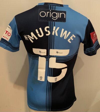 Wycombe Wanderers 2020 - 2021 Match Worn Football Shirt: Blue  short sleeve shirt. Number 15 Muskwe to rear. Match Worn v Tottenham in the FA Cup. Mud marks.