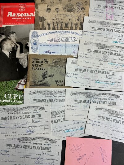 Football Memorabilia Packet: Includes cheque from West Brom to Nobby Stiles in 1984, 10 cheques written by Bolton in 1976, set of Topical Times cards, scrapbook with good Sheffield content, autographs and more.