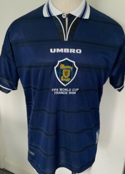 Scotland 1998 World Cup BNWT Replica Football Shirt: Original Umbro product not a later reproduction. Blue short sleeve with FIFA World Cup France 1998 under Scottish badge. Excellent in size XL.