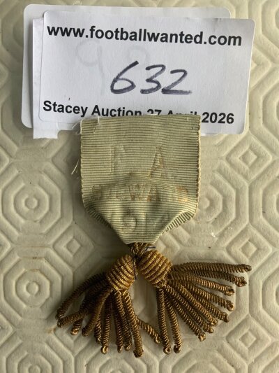 1914 FA Cup Final Stewards Badge: Light blue cloth pin badge with words FA Steward 1914 fading. We are informed this is a stewards badge for the Burnley v Liverpool cup final but it is not evident from item.