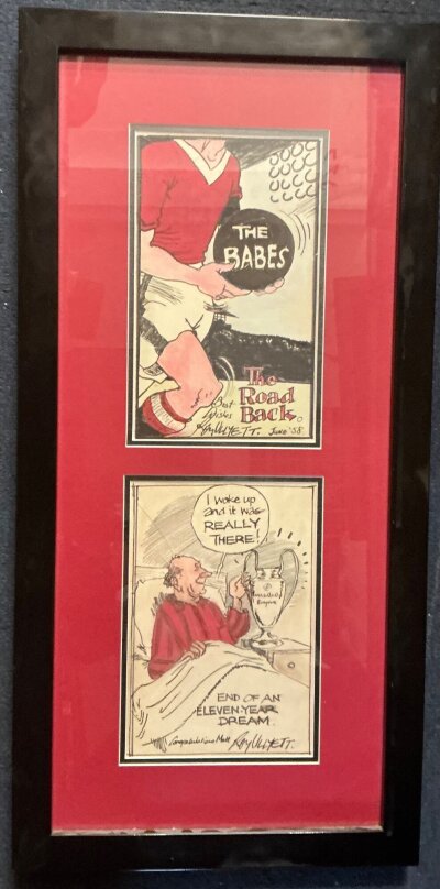 Manchester United Roy Ullyett Football Cartoons: We are informed these could be hand drawn cartoons from the famous artist but they have been framed so we are not sure so this lot sold as copies. One dated June 58 with a Man Utd player carrying a black ball with The Babes written on it. The 2nd cartoon features Busby in bed with European Cup on bedside cabinet with the words I woke up and it was really there end of an eleven year dream congratulations Matt Roy Ullyett. Frame measures 13 x 27 inches.