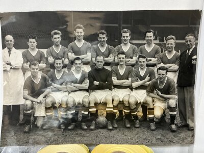 Manchester United 1956 Reserves Team Football Press Photo: Large black and white photo of the Central League team featuring a young Bobby Charlton. Press stamp and annotation to rear.