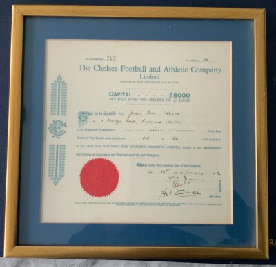 Chelsea Mears Family Framed Share Certificate: Sixteen one pound shares issued in 1973 to Joseph Brian Mears. Attractive certificate with Chelsea Football and Athetic Club Ltd heading and embossed red stamp neatly framed with blue boards and gold frame.