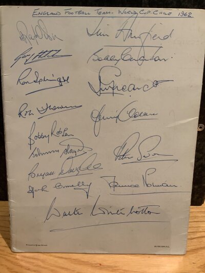 England Football 1962 World Cup Signed BOAC Menu: Rare Monarch BOAC menu which is signed by 14 players and the manager Winterbottom. Signatures include Norman, Greaves, Swan, Flowers, Wilson, Robson and Charlton. Comes with a press photo of the players boarding the plane to Chile.