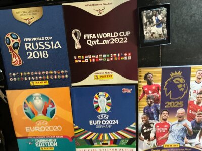 Panini Football Card Albums: World Cup 2018 2022, Euro 2020, Euro 24 (Topps) and an empty Panini 2025. C/W a bag of cards which are modern Topps and Match Attax. Instructions to sell.