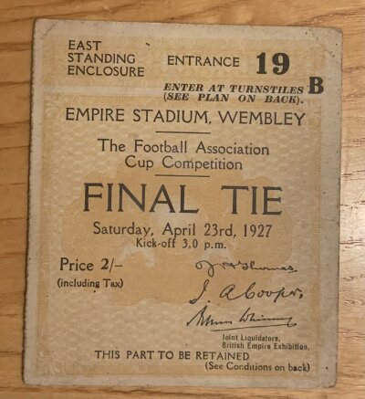 1927 FA Cup Final Football Ticket: Cardiff City v Arsenal  ticket in good condition. C/W autograph of Arsenal goalkeeper Dan Lewis whi is unfortunately credited with the own goal and Charles Buchan the Arsenal captain. Also included is a replica programme and later produced booklet of match.