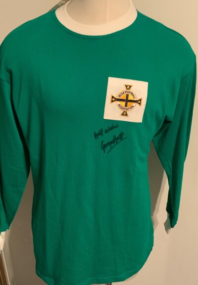 George Best Signed Northern Ireland Football Shirt: Green long sleeve Toffs replica shirt signed to front best wishes George Best.