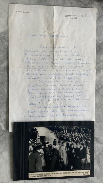 Manchester United Rare 1958 Busby Babes Football Memorabilia: An incredible lot relating to the Munich Air Disaster. Hand written letter from Erika and Dr George Maurer ( Head of Munich Hospital) dated 16 3 1958 to Manchester United chairman Harold Hardman thanking them for the visit of the doctors and nurses to the match on 8 3 1958 v West Brom. Letter is written in English and he explains the unforgettable experience of being applauded by 60000 people. There is also an original photo of the doctors and nurses coming out of the tunnel at Old Trafford. There is a later printed large document on the Civil Aircraft Accident. On Red Star Belgrade official A4 paper there are 11 hand signed autographs. There is an original printed sheet from Eddie Colmans parents stating thanks for the sympathy and a replica copy of the celebration of life. There are 5 original press photos of the match including the famous last line up which are copied from this original. There are 7 more original larger press photos of which 4 relate to the disaster with players returning to Harwich or in hospital. Included are some magazines and newspapers produced later, 57/58 Arsenal v Manchester United programme which was the last time the Babes played together in England, 40th anniversary programmes and invite plus more.