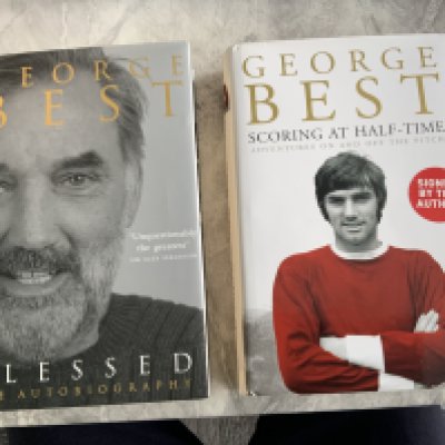 George Best Manchester United Signed Football Books: Scoring At Half Time clearly signed in biro. Blessed autobiography is signed in marker pen and has cut out pictures of Best stuck to inside page around autograph. Both undedicated. (2)