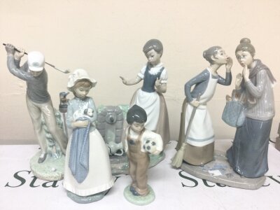 Lladro and NAO porcelain figures the Gossips, sweet girl my pup, golfer. Etc