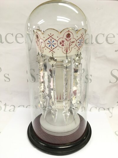 A Victorian luster with glass drops under a glass dome, 45cm tall