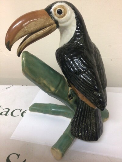 A Ceramic figure of a Toucan perched in bamboo Hight 40cm no obvious damage