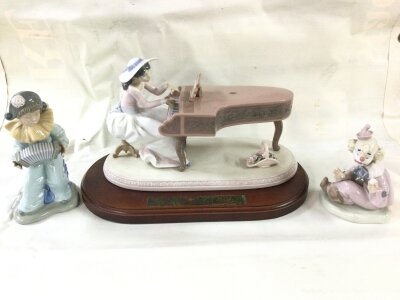 A Lladro pianist figure (rose missing)