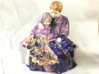 A Doulton figure group The Flower Sellers children HN1206 (slight damage to flowers). 20cm tall