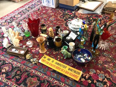 A collection of ceramics including perfume bottles , vases, cap badges, art glass ceramics etc.