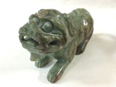 A carved jade Foo dog, 15cm long