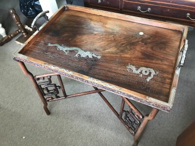 A Chinese tea tray table with silver inlaid dragon design. 76cm wide 50cm long 75cm tall