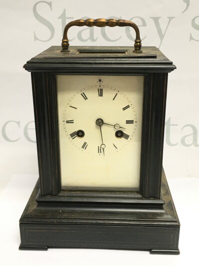An ebonised eight day mantle clock, approx height 22cm. NO RESERVE