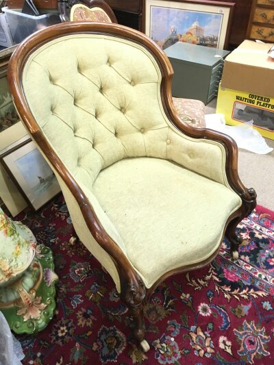 A Victorian walnut armchair with saber legs. Dimensions 65cm wide , 86cm tall, 85cm deep NO RESERVE