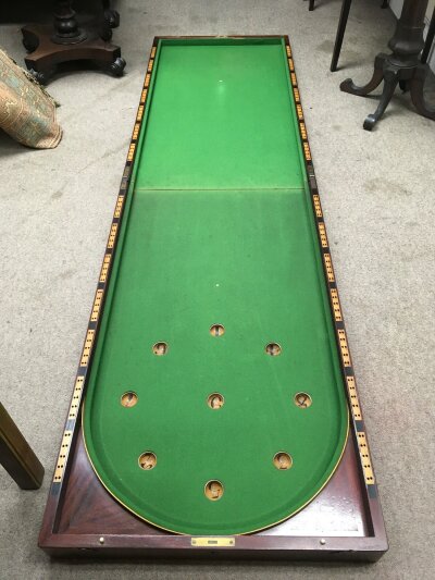 A Victorian folding billiards table top by A W Gamage of Holborn, London, approx 214cm x 61cm when open. Comes with balls, cues etc.