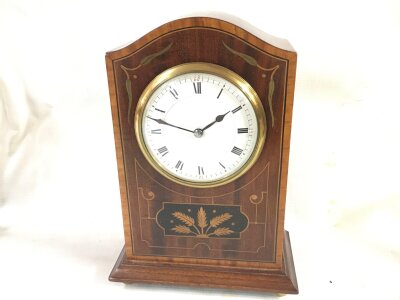 An Edwardian mantle clock. 23cm tall 17cm wide