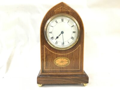 An Edwardian mantle clock 24cm tall 14cm wide
