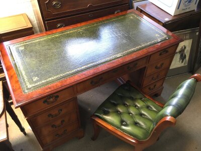 A reproduction yew wood desk and chair , 136cm wide , 69cm long 78cm tall