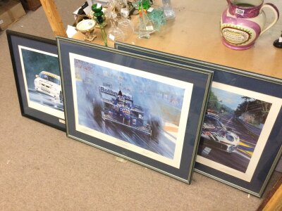 Three formula one and Le Mans signed racing prints. Frame dimensions 88x87cm and 79x63cm