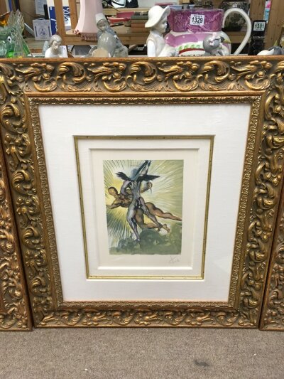 A signed and framed Salvador Dali print titled The Guardian Angels of the Valley. Frame size 62x70cm