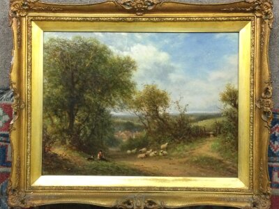 A framed English oil painting view of a flock of sheep. Frame dimensions 52x42cm