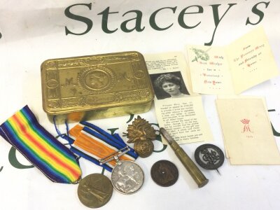 A Queen Mary tin and WW1 medal pair presented to a PTE.A.NASH.1. London reg