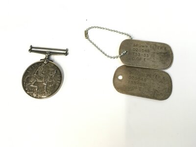 A world war 1 medal awarded to PTE S S Hadler A.S.C and a pair of dog tags.