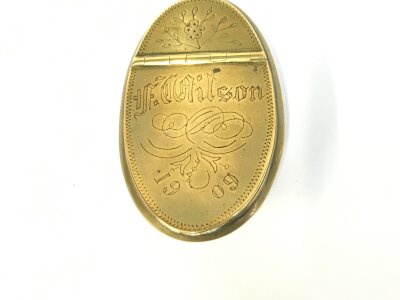 A brass snuff slipper box with engraving for F Wilson 1909