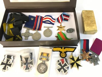 A collection of assorted retrospective war medals etc.