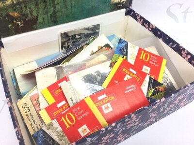 A box of postcards and books of stamps , no Reserve