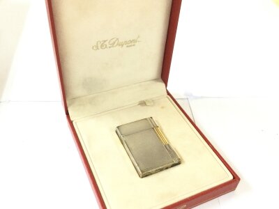 A vintage boxed DuPont lighter
