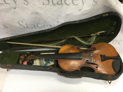 A cased violin bearing a label for Italian maker Nicolaus Amatuz.
