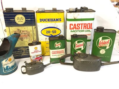 A collection of assorted oil cans including Duckhams, castrol oil Shell etc