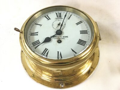 A ships brass cased clock Parker’s & son Liverpool.20cm wide