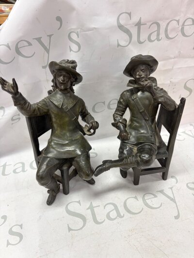 A pair of bronzed metal figures of seated cavaliers the chair rail stamped Geo Maxim (2) Height 26cm A/F NO RESERVE