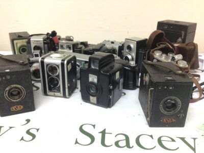 A Collection of Vintage cameras a private collection most of the cameras with original cases and other camera equipment. In several boxes.